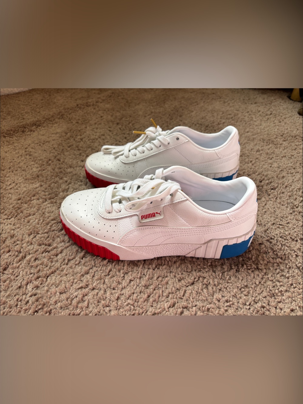 Puma Women’s White Leather Sneakers with Red & Blue Sole Accents